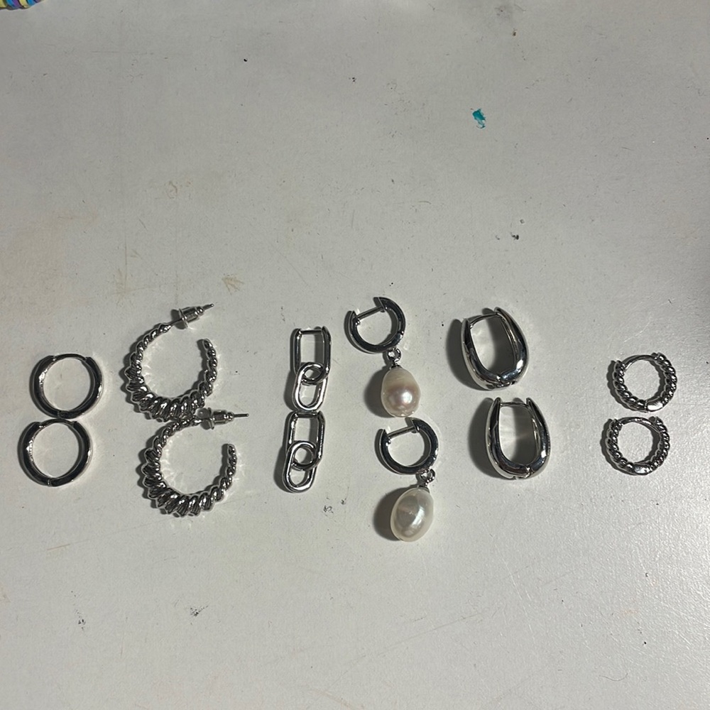 6 pairs of silver hoop earrings